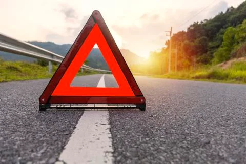 Red triangle, red emergency stop sign, red emergency symbol on road. Stock-Fotos