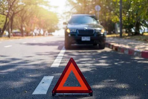 Red triangle, red emergency stop sign, red emergency symbol with  car stop an Stock Photos