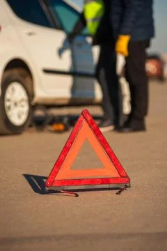 Red triangle warning sign and broken car 스톡 사진