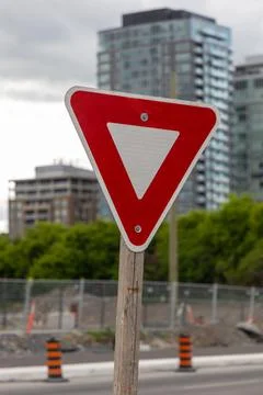 Red triangle yield traffic sign on city street in Ottawa, Canada. Stock Photos