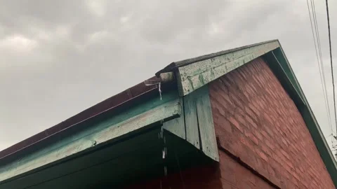 Red Triangular Roof in Rain – Water Dripping from Corner Stock Footage 313942854