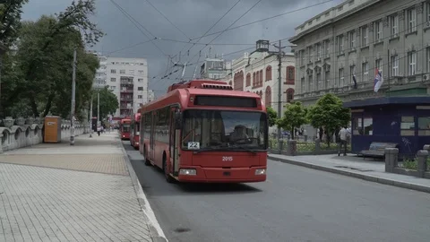 Red Trolleybus leaving the Central Bus Station in Belgrade, focus rack, Cine4 Stock Footage 93260552