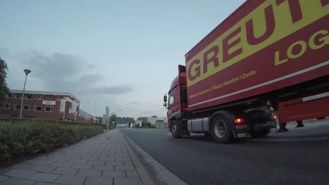 Red truck passing Stock Footage 83624827