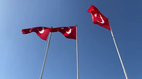 Red turkish flag with red and white moon waving on blue sky background Stock Footage 307698855