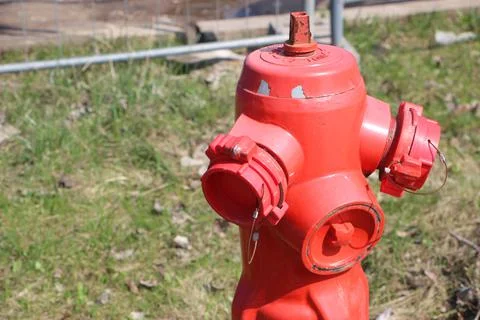 Red typical american fire hydrant in the rural area street 库存照片