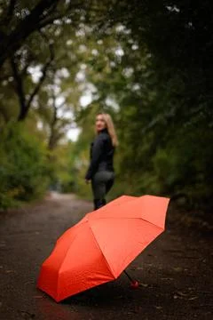 A red umbrella in the fall Photos
