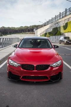 Red universal suv in front of a performance center Stock Photos