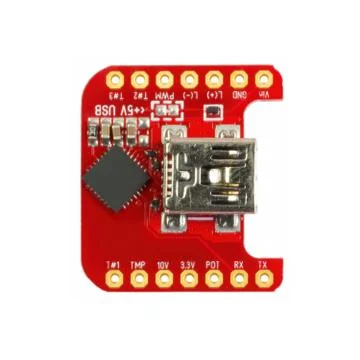 Red universal USB to TTL PCB board surface mount components in a close-up top Foto stock