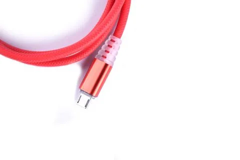 Red USB cable for smartphone charge isolated on white background. Stock Photos