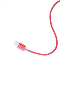 Red USB cable for smartphone charge isolated on white background. Stock Photos