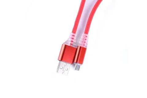 Red USB cable for smartphone charge isolated on white background. Stock Photos