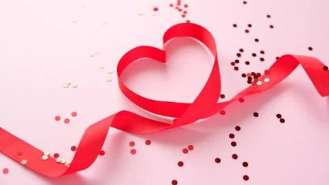Red valentine s elements on pink background Foto stock