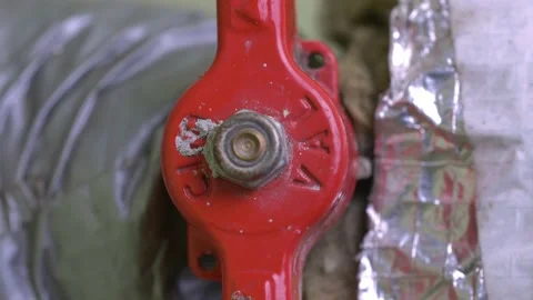 Red Valve being Turned On and Off on Water Pipe Video stock 152304721