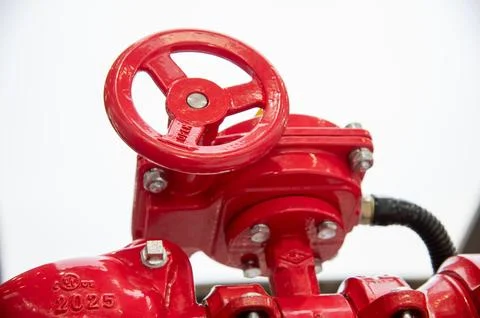 A red valve with a white background Stock Photos