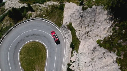Red Van on Winding Mountain Road – Drone View of Swiss Alps near Grindelwald Stockbeeldmateriaal 312266638