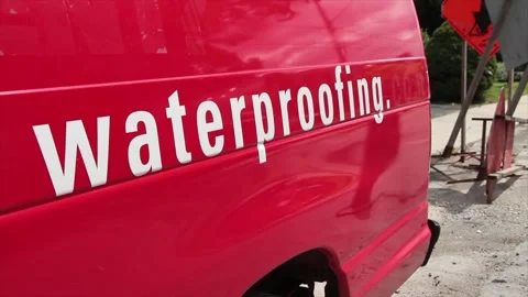 Red van with word caption text writing waterproofing written on the side Stock Footage 248715416