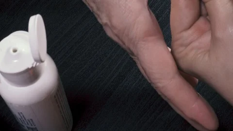 Red varnish on the nail of the thumb Video stock 87339350