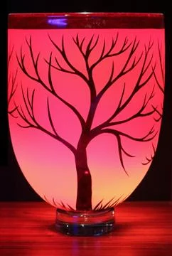A red vase with an etching of a tree Stock Photos