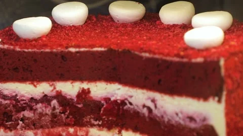 Red velvet cake. Cake in a section, red layers and white cream. Stock Footage 231143923