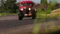 Red vintage car Chevrolet Suburban countryside background HD Footage