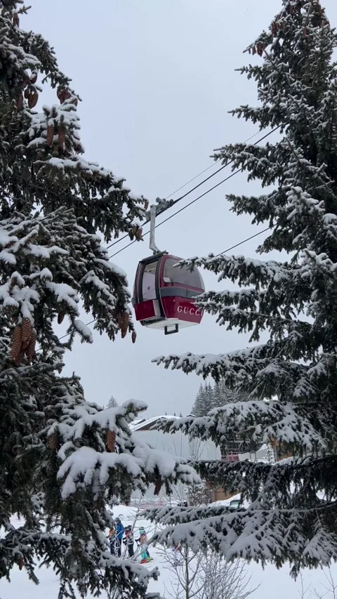 Red vintage ski gondola between the forest on a snowing day Stock Footage 337263148