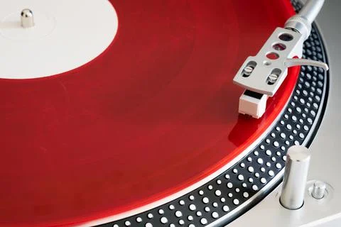 Red vinyl record on the player Stock Photos