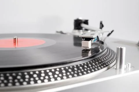 Red vinyl record on the player Stock Photos