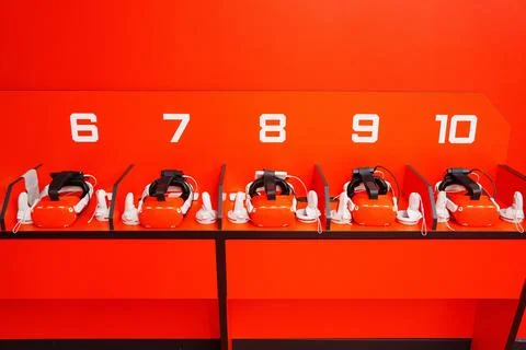 Red Virtual reality helmets. A device for immersing the user in the vr. Stock Photos