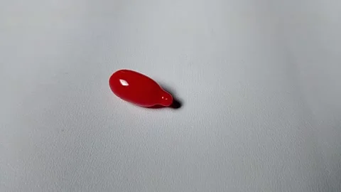 Red Vitamin A on white background. Stock Footage 314699738