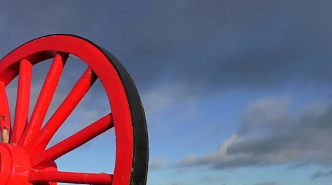 Red wagon wheel &amp; clouds (time lapse) Stock Footage 45905038