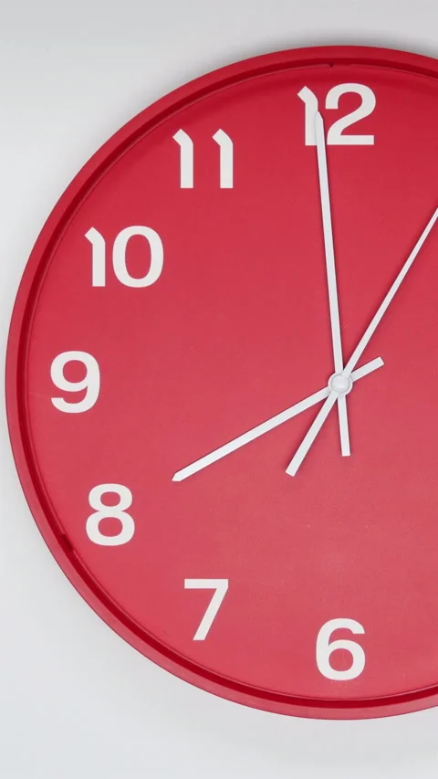 A Red Wall Clock With The Time Of 8.00 Am Or Pm. A White Hands Of The Clock, The Stock Footage 266741498