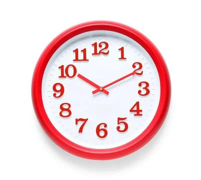 Red wall clock with white face and bold red numbers, time management and punc Stock Photos