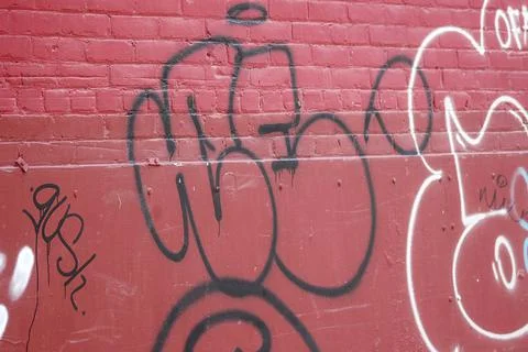 Red wall with graffiti Stock Photos