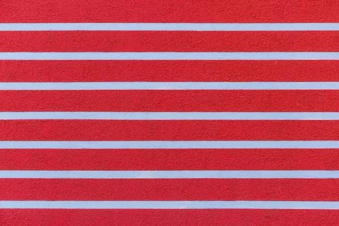 Red wall with a horizontal stripe pattern for wallpapers and background. Stock Photos