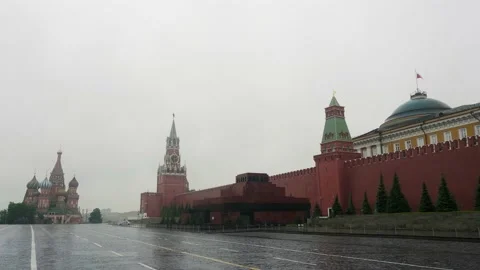 Red wall of Kremlin and Mausoleum. Sad view of empty Red square during rainy day Stock Footage 133246789