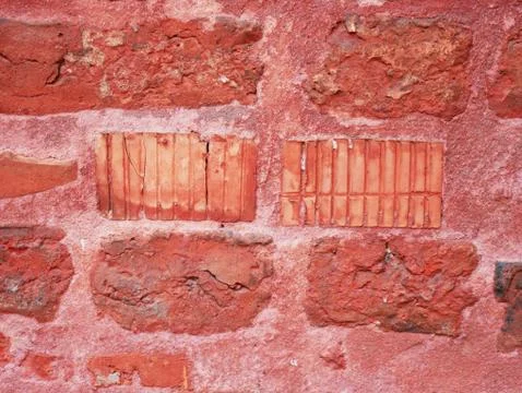 Red wall. Old brick texture. Irregular pattern. Stock Photos