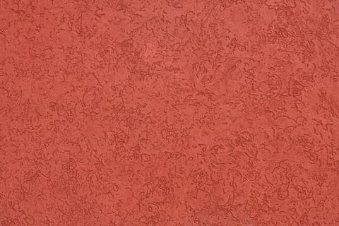 Red wall with patterned indentations Foto stock
