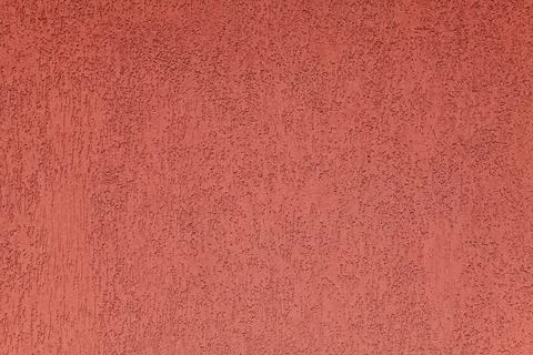 Red wall, texture, background. Plastered building wall. Rough surface Stock Photos