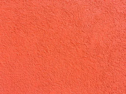 Red wall texture background. Textured concrete plaster with spraying in the form Foto stock