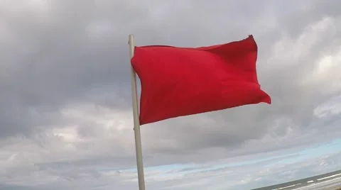Red Warning Flag at the Beach Stock Footage 68779783