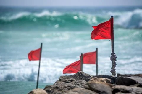 Red warning flag on beach Foto stock