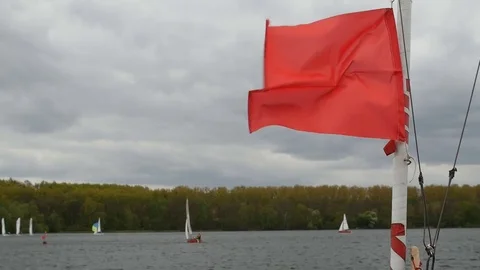 Red warning flag on the ship during a storm. Stock Footage 81050886