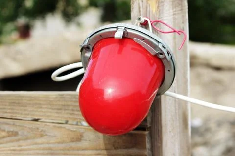 Red warning light which enclosing the ditch, where the repair of water pipes Stock Photos