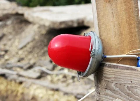Red warning light which enclosing the ditch, where the repair of water pipes Stock Photos