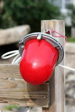 Red warning light which enclosing the ditch, where the repair of water pipes. Stock Photos