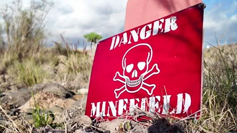 Red warning sign indicating a dangerous minefield Video stock 332164143