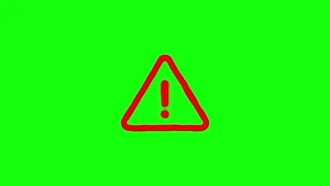 Red warning triangle sign appearing on solid green screen background digita.. Stock Footage 345547912