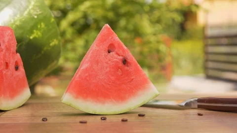 Red watermelon slice on the table - close up Stock Footage 113400764