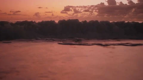 Red Waves On Sunset Beach Background 動画素材 169864751