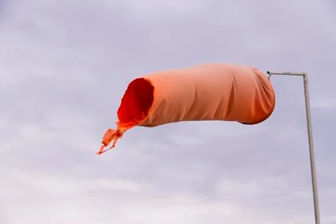 Red weathered windsock Stock Photos